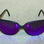 Matte navy Revo frames w/reflective purple lenses Matte navy Revo frames w/reflective purple lenses, $100