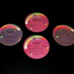 Set of 4 coasters made from the centers of albums, w/cork underneath Set of 4 coasters made from the centers of albums, w/cork underneath, $25/set