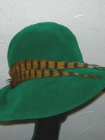 Vintage green brimmed hat with feather accent, a Mr. John Classic