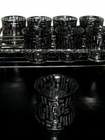 Set of 8 silver trimmed drinking glasses and caddy