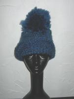 Blue knit cap with extra large pompom