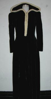 Black velvet hooded cloak dress trimmed with white rabbit fur, from Neiman Marcus in Dallas