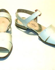 Ferragamo cream patent leather sandals with gold signature ornament buckle