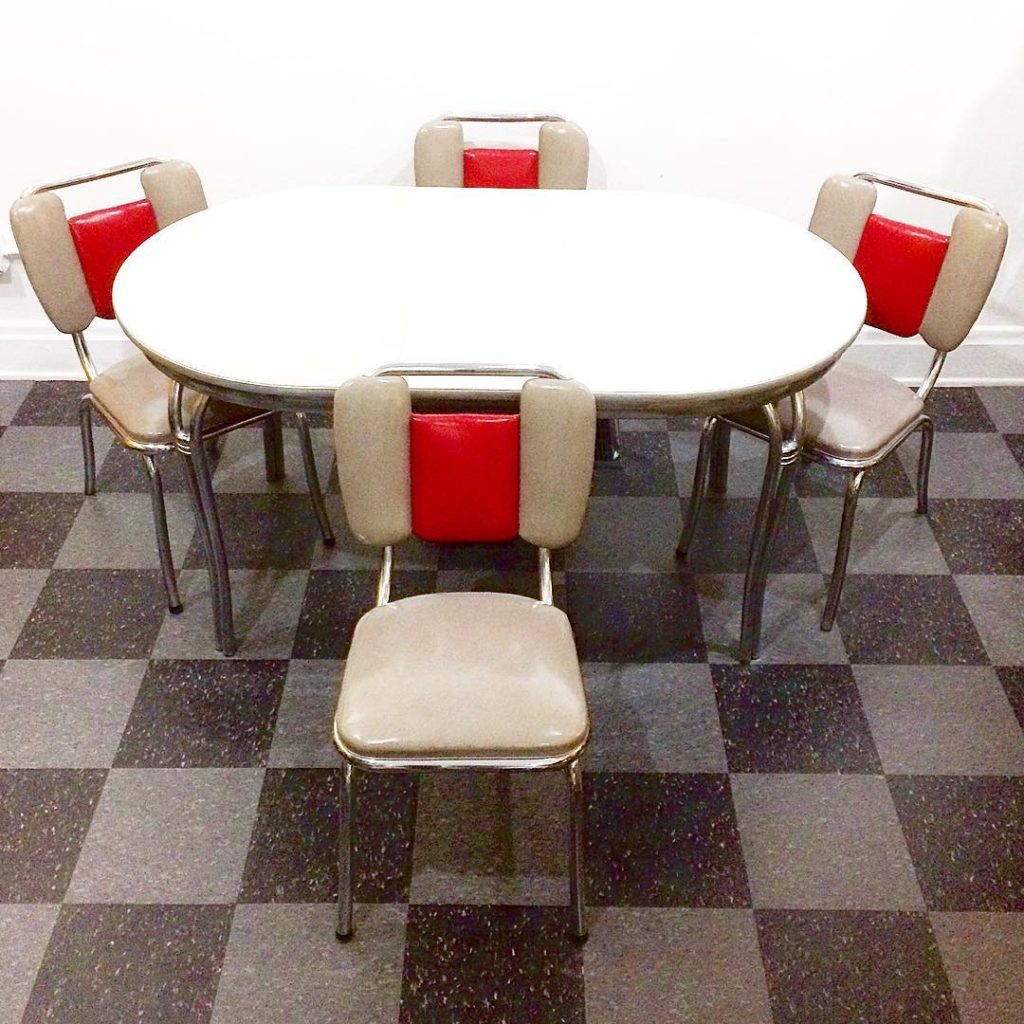 Howell chrome frame and speckled gray Formica top table, and 4 Kuehne chrome frame chairs that have red and gray vinyl upholstery, SOLD